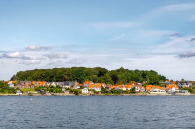 Townscape of Hoeruphav, town on Als Island, from Hoerup Hav bay, Southern Denmark clipart