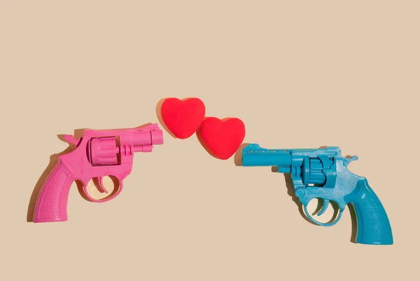 Creative Valentines Romantic Concept Pink Blue Gun Firing Hearts Yellow Royalty Free Stock Obrázky
