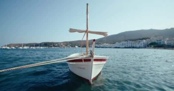 Traditional Spanish Sailboat Anchored Marina Sways Slowly Water Fishing Boat — стоковое видео