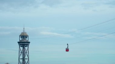 Funicular gondola moves fast along ropeway to the upper stop point. Red cable cars on their way to the terminal. Transportation and adventure for tourists. 