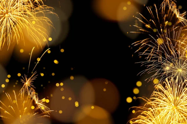 Elegant gold and black background with fireworks and light sparkles. Background for birthday celebrations, big events, congratulations and holidays like 4th of July or New Year\'s Eve