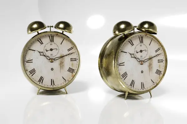 Gold plated retro alarm clock. Old clock realistic 3D render. Roman numeral clock.