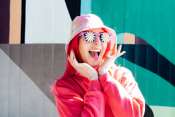 Wow, excited emotional screaming woman in sunglasses with flowers stickers. Playful woman with pink hair,bucket hat and magenta sweatshirt. Vanilla Girl. Kawaii vibe. Candy colors design. Flower mood