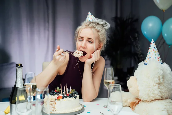 Upset Unhappy Attractive Woman Eating Festive Cake While Celebrating Birthday —  Fotos de Stock