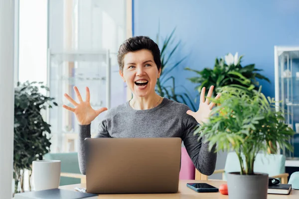 stock image Excited happy middle aged neutral gender woman feeling winner rejoicing online win got new job opportunity, overjoyed motivated doing yes gesture, receive good results on pc celebrating admission.