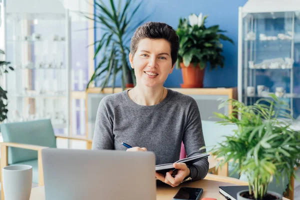 Smiling Neutral Gender Middle Aged Person Making Notes Her Paper — Stock Photo, Image
