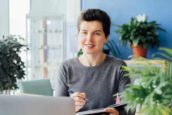Smiling Neutral Gender Middle Aged Person Making Notes Her Paper — Stock Photo, Image