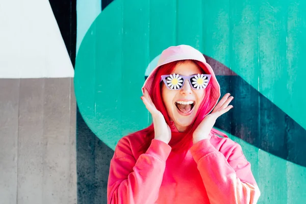 Wow, excited emotional screaming woman in sunglasses with flowers stickers. Playful woman with pink hair,bucket hat and magenta sweatshirt. Vanilla Girl. Kawaii vibe. Candy colors design. Flower mood.