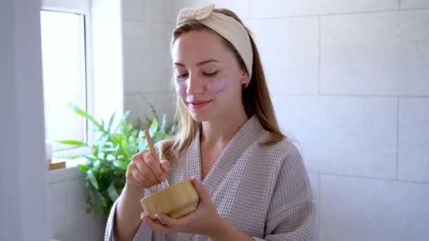 Young Woman Bathrobe Looking Mirror Applying Natural Cosmetic Clay Mask — Video