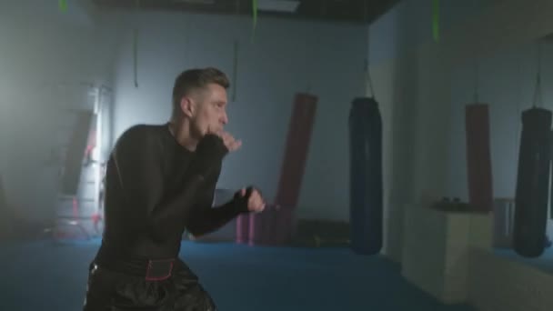 Handheld Aggressive Fighter Trains His Punches Defense Boxing Gym Boxer — Stock Video