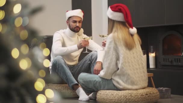 Celebrating Christmas Young Couple Sits Floor Living Room Drinking Champagne — Stock Video