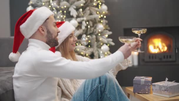 Celebrating Christmas Young Man Woman Santa Hats Sits Floor Living — Stock Video