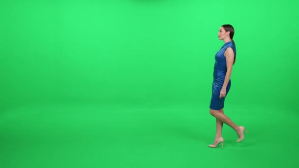 Young Woman Blue Dress Walking Green Background Chromakey Template Woman Royalty Free Stock Footage