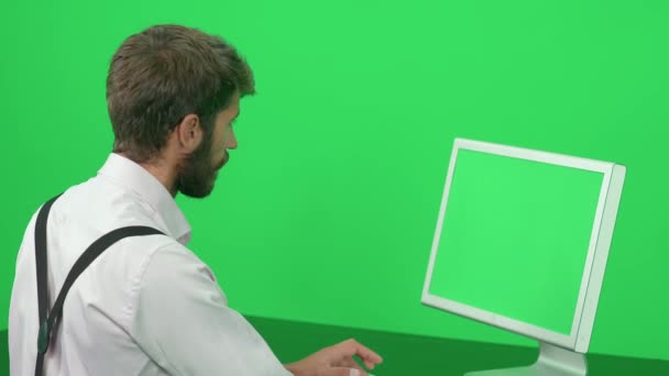 Focused Journalist Working While Sitting Desk Green Background Chroma Key — Stock Video