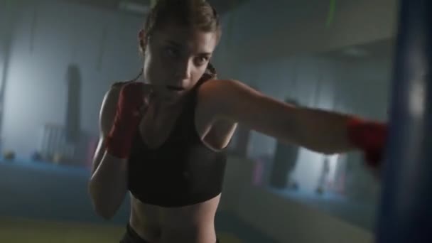Female Fighter Beats Punching Bag Trains His Punches Training Day — Stock Video