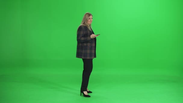 Woman Uses Smartphone Manager Green Background Communicates Online Chromakey Template — Stock Video