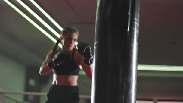 Boxing Woman Fighter Trains His Punches Beats Punching Bag Training — Stock Video