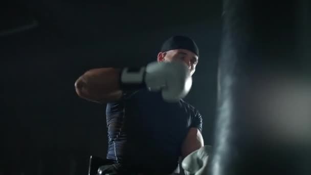 Disabled Man Fighter Wheelchair Trains Punches Punching Bag Training Boxing — Stock Video