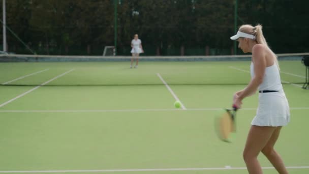 Soft Focus Back View Woman Pro Tennis Player Hits Ball — Stock Video