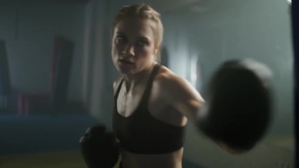 Woman Power Fighter Trains His Punches Beats Punching Bag Training — Stock Video