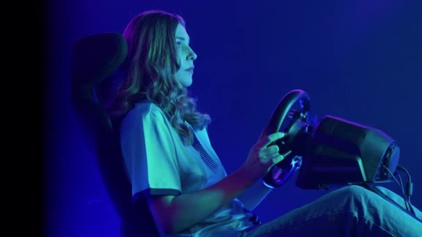 Young Woman Gamer Playing Racing Simulator Machine Side View — Stock Video