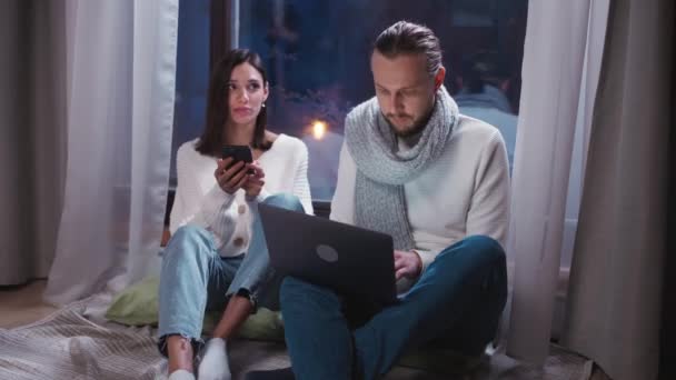 Winter Time Freelancer Sitting Floor Working Laptop His Girlfriend Sitting — Stock Video