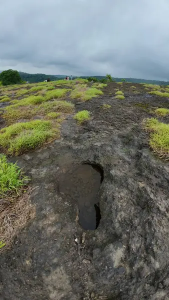 Stock image Rocky Terrain Landscape with Green Patches at Kanheri Caves, Mumbai, India