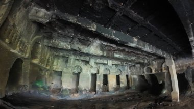 Ancient Buddhist carvings at Kondana Caves, Maharashtra, India, captured during the monsoon season clipart