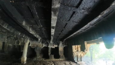 Ancient Buddhist carvings at Kondana Caves, Maharashtra, India, captured during the monsoon season clipart