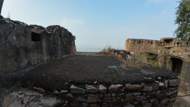 Achrol Fort, a decaying and abandoned fortress near Jaipur, Rajasthan, with crumbling walls and a haunting atmosphere