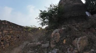 Achrol Fort, a decaying and abandoned fortress near Jaipur, Rajasthan, with crumbling walls and a haunting atmosphere