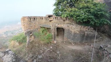Achrol Fort, a decaying and abandoned fortress near Jaipur, Rajasthan, with crumbling walls and a haunting atmosphere