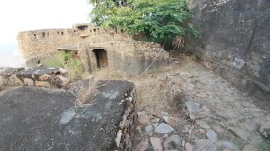 Achrol Fort, a decaying and abandoned fortress near Jaipur, Rajasthan, with crumbling walls and a haunting atmosphere