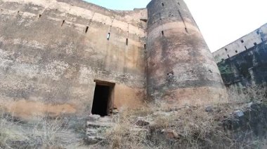 Achrol Fort, a decaying and abandoned fortress near Jaipur, Rajasthan, with crumbling walls and a haunting atmosphere