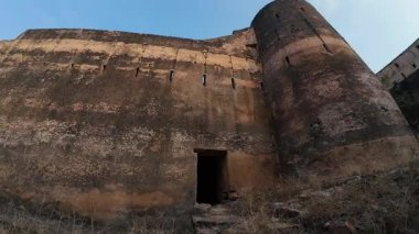 Achrol Fort, a decaying and abandoned fortress near Jaipur, Rajasthan, with crumbling walls and a haunting atmosphere