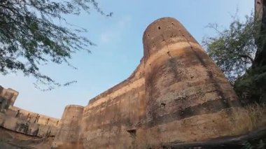 Achrol Fort, a decaying and abandoned fortress near Jaipur, Rajasthan, with crumbling walls and a haunting atmosphere