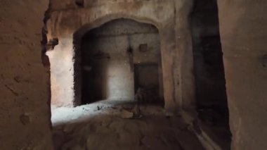 Achrol Fort, a decaying and abandoned fortress near Jaipur, Rajasthan, with crumbling walls and a haunting atmosphere
