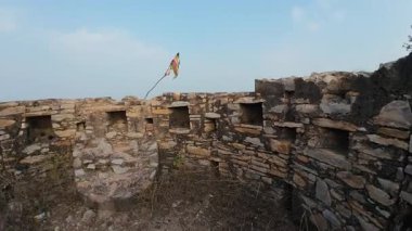 Achrol Fort, a decaying and abandoned fortress near Jaipur, Rajasthan, with crumbling walls and a haunting atmosphere