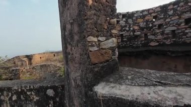 Achrol Fort, a decaying and abandoned fortress near Jaipur, Rajasthan, with crumbling walls and a haunting atmosphere