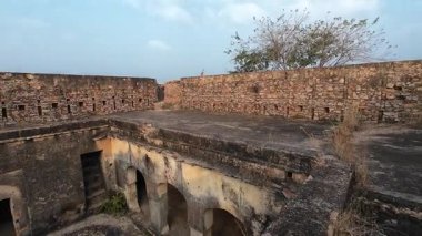 Achrol Fort, a decaying and abandoned fortress near Jaipur, Rajasthan, with crumbling walls and a haunting atmosphere