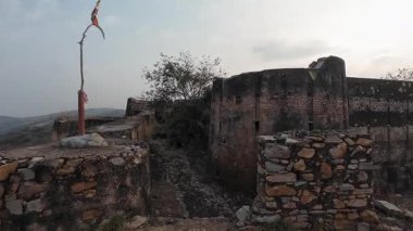 Achrol Fort, a decaying and abandoned fortress near Jaipur, Rajasthan, with crumbling walls and a haunting atmosphere