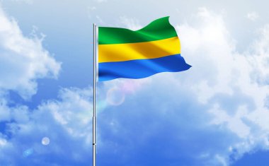 Gabon bayrağı dalgalanır parlak mavi gökyüzünde