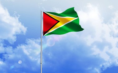 Guyana bayrağı dalgalanır parlak mavi gökyüzünde