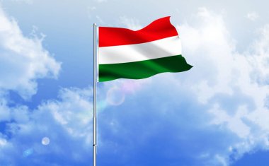 Parlak mavi gökyüzünde sallanan Macaristan bayrağı