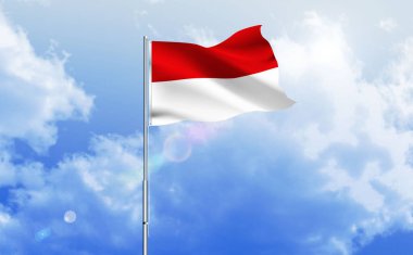 Endonezya bayrağı dalgalanır parlak mavi gökyüzünde