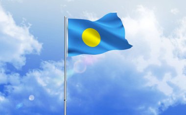 Palau bayrağı dalgalanır parlak mavi gökyüzünde