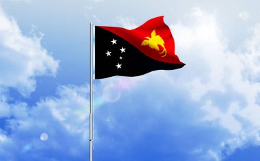 Papua Yeni Gine bayrağı mavi gökyüzünde dalgalanıyor.