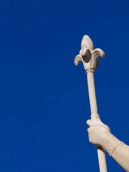 Lily scepter, an heraldic symbol of royalty and power (with blue sky and copy space)