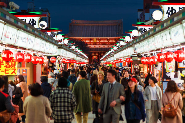 Tokyo, JAPAN, FEBRUARY 20, 2019 - Tourists flocking to Senso-ji Temple and Nakamise shopping street in Asakusa district at night