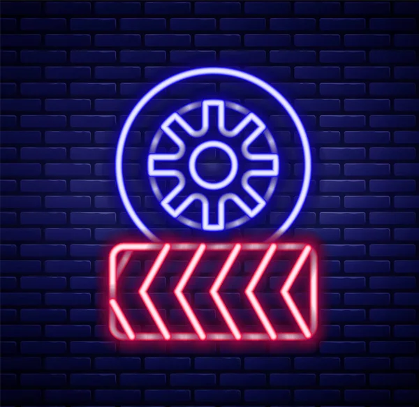 stock vector Glowing neon line Car tire wheel icon isolated on brick wall background. Colorful outline concept. Vector